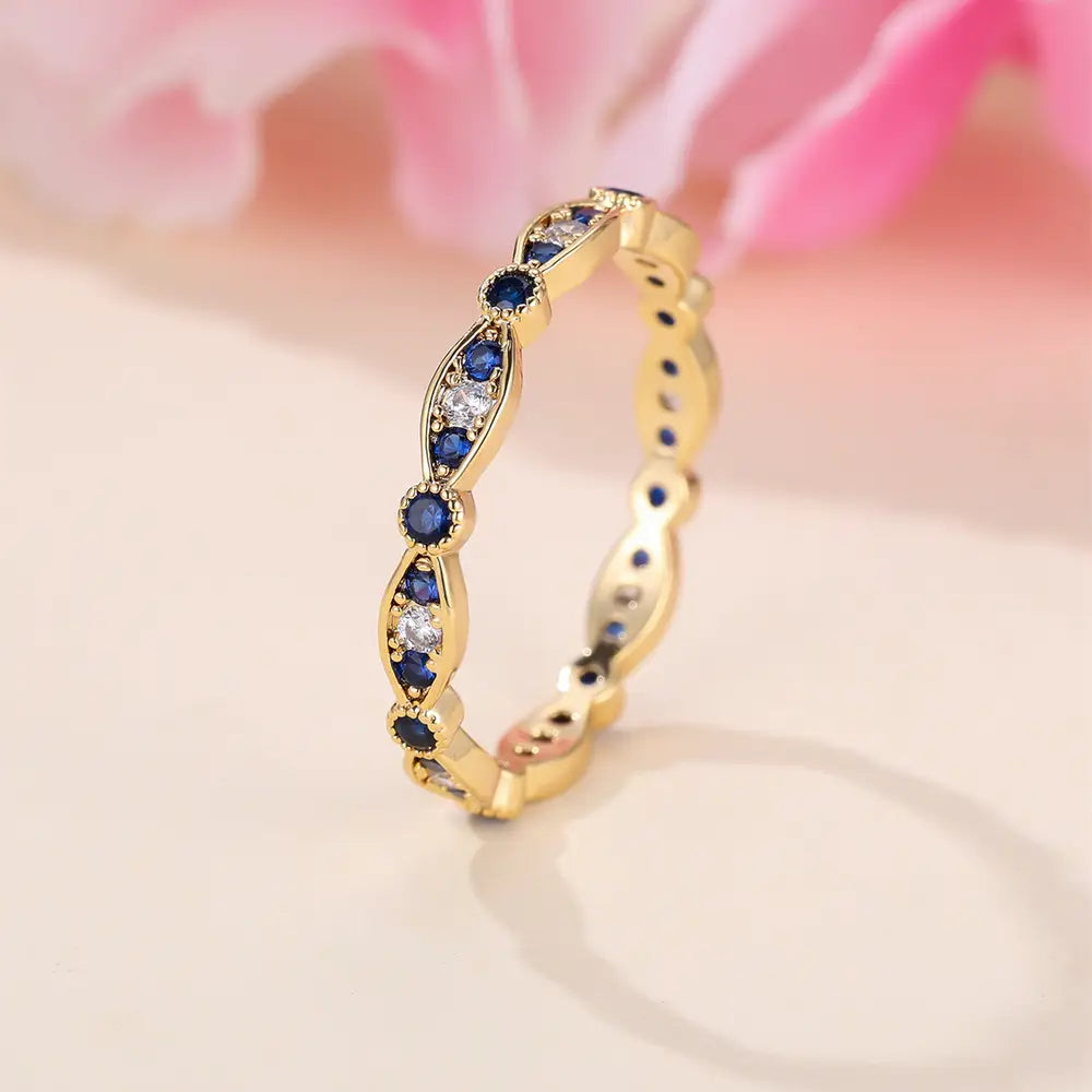 Bague de fiançailles plaquée or 18 carats avec zircones bleues et blanches pavées