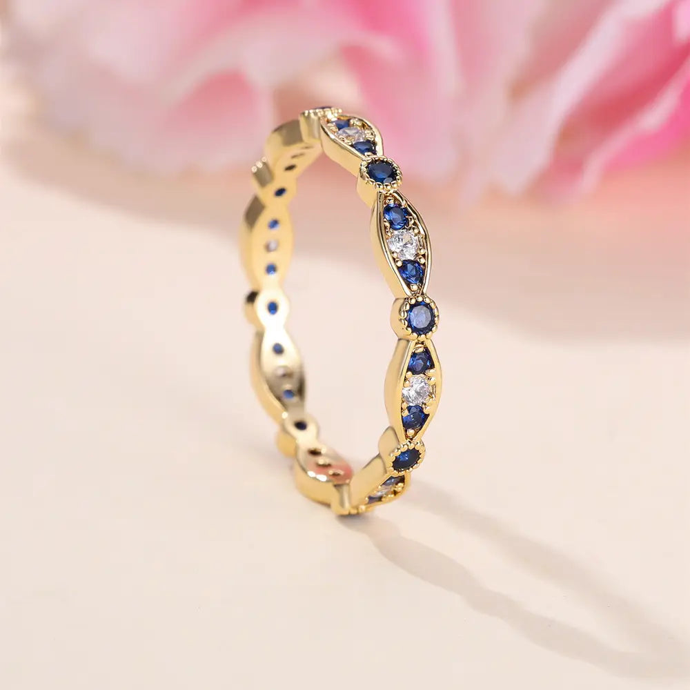 Bague de fiançailles plaquée or 18 carats avec zircones bleues et blanches pavées