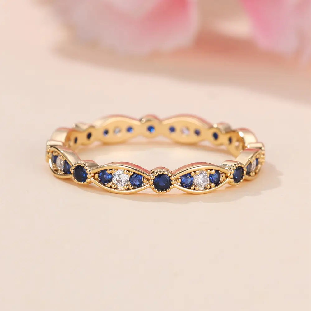 Bague de fiançailles plaquée or 18 carats avec zircones bleues et blanches pavées