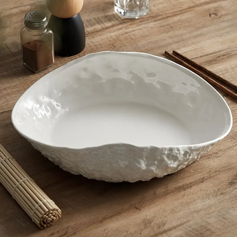 Elegante keramische serveerschaal in schelpvorm