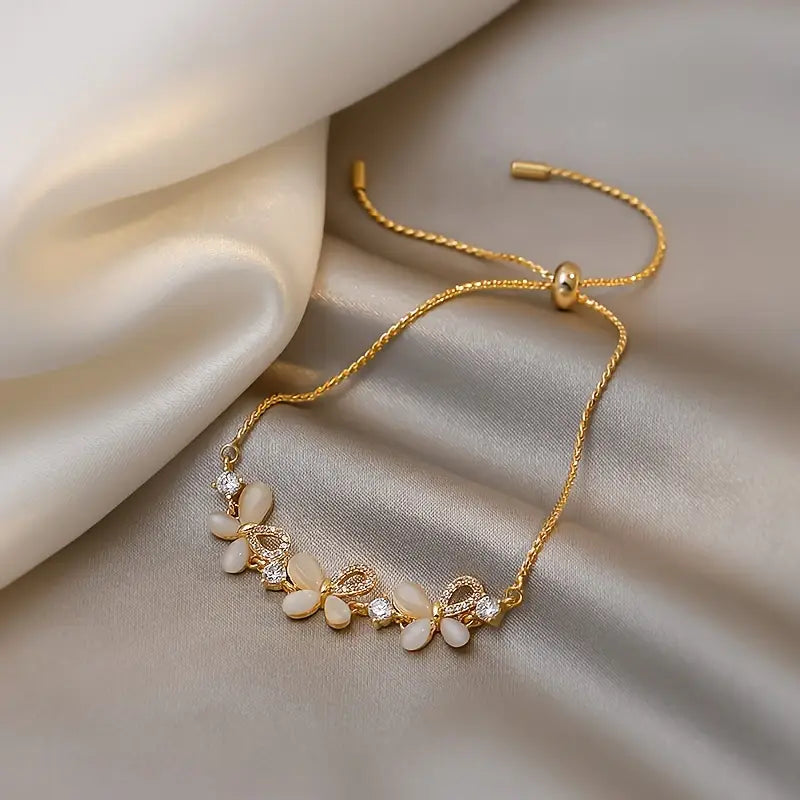 Copper Butterfly Bracelet with Sparkling Cat Eye Stone and Cubic Zirconia Inlay