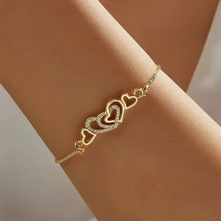 Gold-Tone Bracelet with Dazzling Heart Charms