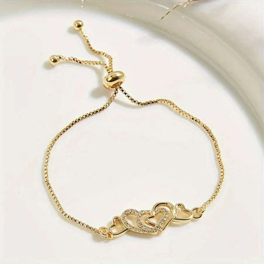 Gold-Tone Bracelet with Dazzling Heart Charms